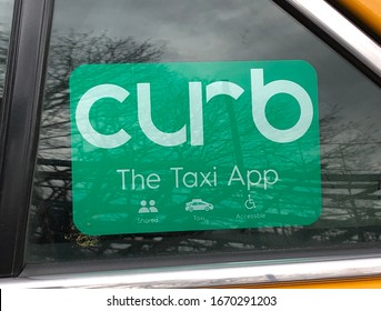 New York, New York / March 10 2020: Closeup Of Curb Window Cling On A Taxicab Window In Queens, NY