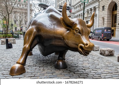 NEW YORK, NEW YORK - MARCH 19, 2020: The Charging Bull or the Wall Street Bull in the Financial District of Manhattan, New York City is available for a clean shot without any tourists in the way.