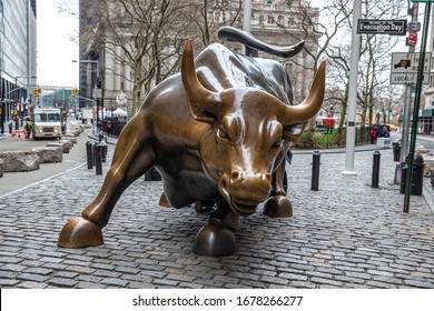 NEW YORK, NEW YORK - MARCH 19, 2020: The Charging Bull Or The Wall Street Bull In The Financial District Of Manhattan, New York City Is Available For A Clean Shot Without Any Tourists.