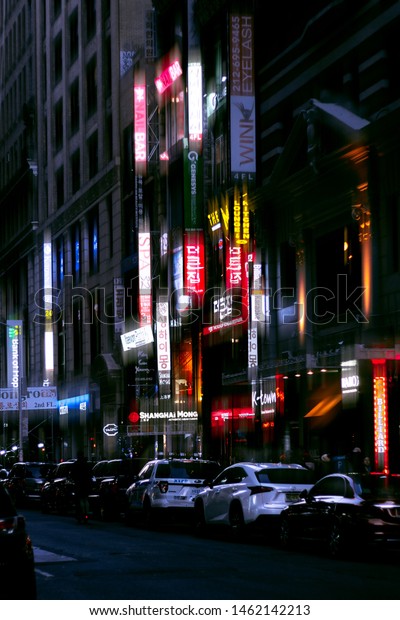 NEW YORK - MARCH 25, 2019: Koreatown in New York\
city at night in cyberpunk vibes with cartels turning on and the\
cold weather.
