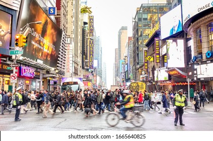 NEW YORK - MARCH 27, 2015: Melting Pot People Crossing Road On 7th Avenue Intersection With W 42nd Street - Everyday Life In The Heart Of Manhattan Southbound Below Central Park - Vivid Colors