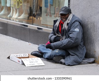 NEW YORK - MARCH 7, 2019: Homeless man at 5th Avenue in Midtown Manhattan