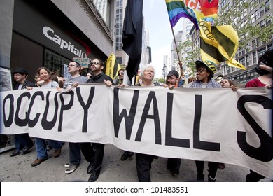 NEW YORK - MAY 1: Protesters March Past A Capital One Bank On Their Way To Union Square From Bryant Park During Occupy Wall St 'May Day' Protests On May 1, 2012 In New York, NY.