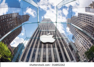 NEW YORK - MAY 13, 2015: Apple logo at the entrance of 5th Avenue store in Manhattan. As of 2014, Apple employs 72,800 permanent full-time employees, maintains 437 retail stores in fifteen countries. 