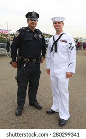 NEW YORK - MAY 20, 2015:  NYPD Police Officer And US Sailor During Fleet Week 2015 In New York