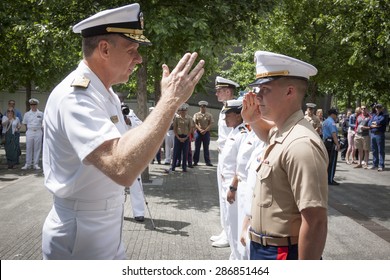 NEW YORK - MAY 22 2015: A US Marine Renders A Salute To Admiral Phil Davidson, Commander, US Fleet Forces Command, During The Promotion Ceremony At The National September 11 Memorial Site.