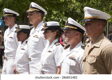 NEW YORK - MAY 22 2015: Participating US Navy And Marine Corps Personnel Stand At Attention At The Promotion Ceremony At The National September 11 Memorial Site During Fleet Week 2015.