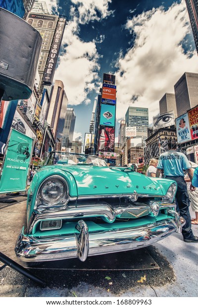 NEW YORK -\
MAY 22: Old car in Times Square, May 22, 2013 in New York City.\
Times Square is the most visited tourist attraction in the world\
with over 39 million visitors\
annually
