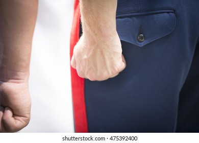 NEW YORK MAY 27 2016: Clenched Fists Of US Marine Corpsman Standing At Attention During The Re-enlistment And Promotion Ceremony At The National September 11 Memorial Site During Fleet Week 2016.