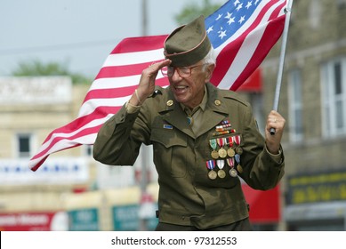 NEW YORK - MAY 29:  An unidentified veteran salutes as he marches in the Little Neck/Douglaston Memorial Day Parade May 29, 2006 in Queens, NY.