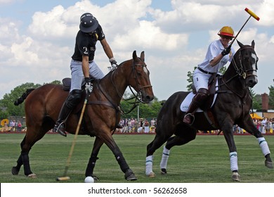 NEW YORK - MAY 30: Argentine polo player Nacho Figueras (L) competes in the Veuve Clicquot Manhattan Polo Classic at Governors Island on May 30, 2009 in New York City.