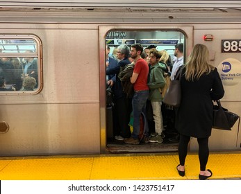 New York - May 6 2019: Crowded Box Car At The Subway In New York City. The New York City Subway Is The Largest Rapid Transit System In The World By Number Of Stations