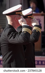 NEW YORK - NOV 11, 2014: Two Commanders From The US Navy Salute As They March Past The VIP Stage During The 2014 America's Parade Held On Veterans Day In New York City On November 11, 2014.