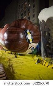 NEW YORK - NOV 25 2015: Macys Animated Character Virginia Novelty Balloon Tied Down With Sandbags And Netting During Macy's Giant Balloon Inflation Event Held The Day Before Thanksgiving In Manhattan.