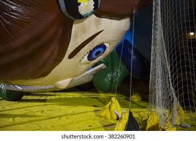 NEW YORK - NOV 25 2015: Macys Animated Character Virginia Novelty Balloon Tied Down With Sandbags And Netting During Macy's Giant Balloon Inflation Event Held The Day Before Thanksgiving In Manhattan.