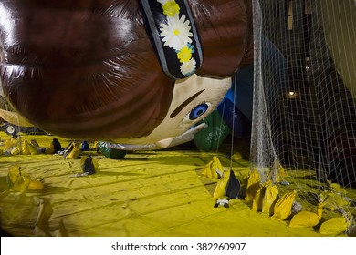 NEW YORK - NOV 25 2015: Macys Animated Character Virginia Novelty Balloon Tied Down With Sandbags And Netting During Macy's Giant Balloon Inflation Event Held The Day Before Thanksgiving In Manhattan.