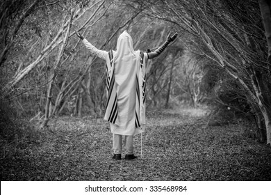 NEW YORK - NOVEMBER 3: Ultra Orthodox Jewish man praying in the forest in the morning. Jewish men pray morning prayer called Shacharis every day as observed on November 3 2015