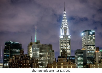 NEW YORK - NOVEMBER 8, 2013: Chrysler Building At Night In Midtown Manhattan New York City. The Chrysler Building Is A Skyscraper In NYC, On The East Side Of Manhattan In The Turtle Bay Area.