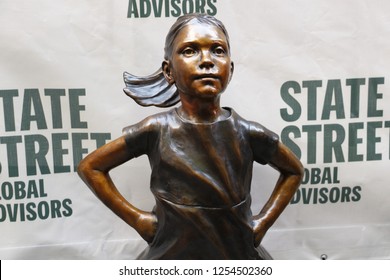 New York, NY - 12.10.2018 : Unveiling of the new, permanent location of Fearless Girl statue. She is now facing NYSE in downtown Manhattan. 