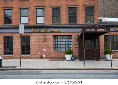NEW YORK, NY - APRIL 20, 2020: The famous Peter Luger steakhouse in Willaimsburg Brooklyn is closed.  New Yorkers continued to battle Covid-19 through social isolation.
