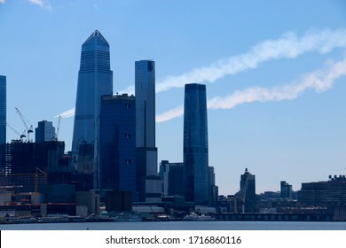 New York, NY - April 28 2020: Vapor Trails From The Navy Blue Angels And USAF Thunderbirds Flyover Tribute To Coronavirus Victims Linger In The Sky Over Hudson Yards And The Javits Center