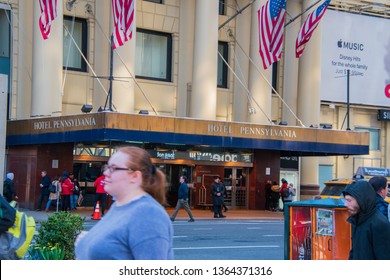 New York, NY - April 3, 2019: Front Entrance And Marquee Of The Hotel Pennsylvania In Manhattan, New York City With The Doorman In Front And Pedestrians Passing By As Seen On This Date