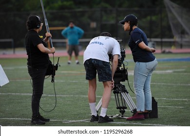 New York, NY; Aug 2018: A Film Crew Shoots A Scene On A Football Field