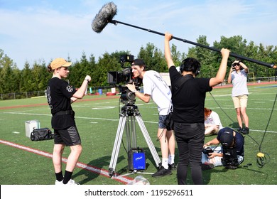 New York, NY; Aug 2018: A Film Crew Shoots A Scene On A Football Field