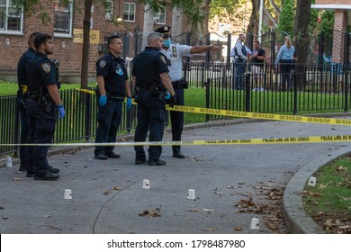 NEW YORK, NY AUGUST 18: NYPD Police Officers Investigate A Shooting At The Ravenswood Houses Housing Complex In Astoria Were Four People Shot On August 18, 2020 In Queens Borough Of New York City.