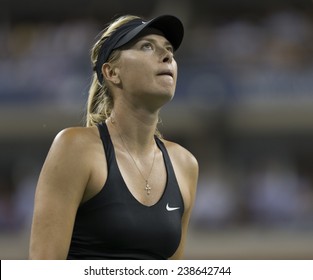 NEW YORK, NY - AUGUST 25: Maria Sharapova of Russia reacts during 1st round match against Maria Kirilenko of Russia at US Open tennis tournament in Flushing Meadows USTA Tennis Center 2014