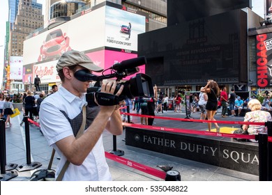 New York, NY: August 28, 2016: A Documentary Film Maker In The Times Square Area Takes Video. On An Average Day, 360,000 People Visit Times Square.