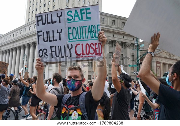 NEW YORK, NY – AUGUST 3, 2020: BLM, UFT and other\
groups participate in a National Day of Resistance to protest for\
demands including no reopening of schools, police-free schools, and\
federal funds.