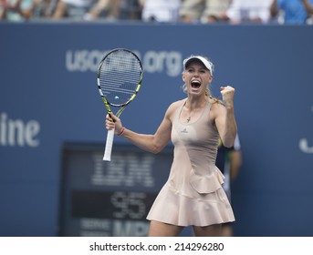 NEW YORK, NY - AUGUST 31, 2014: Caroline Wozniacki of Denmark celebrate victory of 4th round match against Maria Sharapova of Russia at US Open tennis tournament in Flushing Meadows USTA Tennis Center
