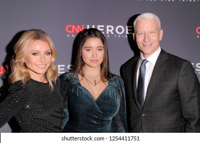 NEW YORK, NY - DECEMBER 09: Kelly Ripa, Lola Grace Consuelos and Anderson Cooper attend the 12th Annual CNN Heroes gala at American Museum of Natural History on December 9, 2018 in New York City.