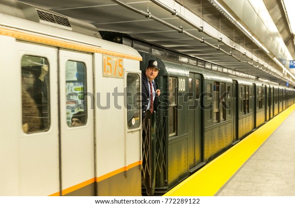 New York, NY - December 10, 2017: New\
Yorkers and tourists ride Holiday Nostalgia Train on vintage subway\
cars courtesy of Metropolitan Transit\
Authority