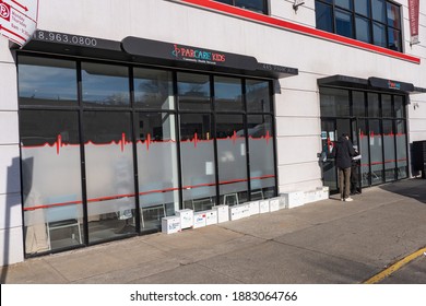 NEW YORK, NY – DECEMBER 27: Customer Talks To Security Guard At The ParCare Community Health Network Williamsburg Office On December 27, 2020 In Brooklyn Borough Of New York City.