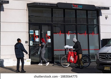 NEW YORK, NY – DECEMBER 27: A Staff Member Gets Food Delivery In Front Of ParCare Community Health Network Williamsburg Office On December 27, 2020 In Brooklyn Borough Of New York City.