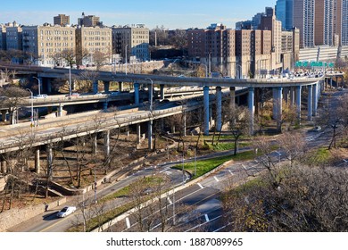New York, NY - December 7 2020: Entrance ramps to the George Washington Bridge in Washington Heights, Manhattan, NYC. In the foreground is the Henry Hudson Parkway on a sunny winter day.