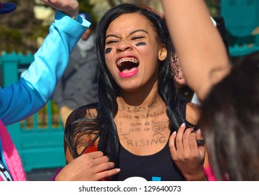 NEW YORK, NY - FEB 14: One Of Nearly 300 Women Who Took Part In A One Billion Rising Event In Washington Square Park In New York City, NY On February 14, 2013 To Protest Violence Against Women.