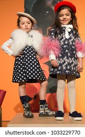 New York, NY - February 25, 2018: Young models show off dresses by Charabia Paris brand at PetiteParade presentation at Childrens Club at Jacob Javits Center