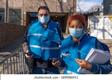 NEW YORK, NY – JANUARY 10, 2021: A Vaccine Hub Safety Worker Observe The Procedures At The NYC Health Department COVID-19 Vaccine Hub At Hillcrest High School In Queens.