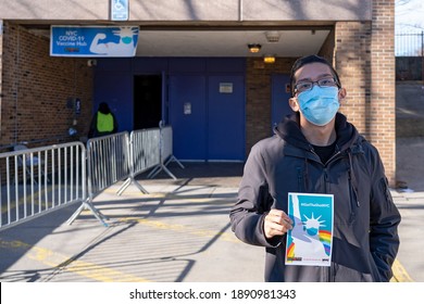 NEW YORK, NY – JANUARY 10, 2021: A Man Displays His “IGotTheShotNYC” Banner After Exiting The NYC Health Department Vaccine Hub At Hillcrest High School In Queens.