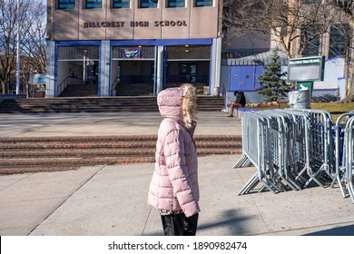 NEW YORK, NY – JANUARY 10, 2021: A Woman Who Is Eligible And Registered Waits In Line To Get COVID-19 Vaccine At NYC Health Department Vaccine Hub At Hillcrest High School In Jamaica, Queens.