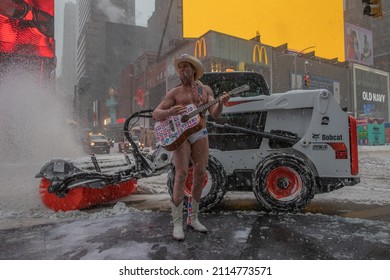 NEW YORK, N.Y. – January 29, 2022: The Street Performer Known As The Naked Cowboy Performs In Times Square During A Snowstorm.