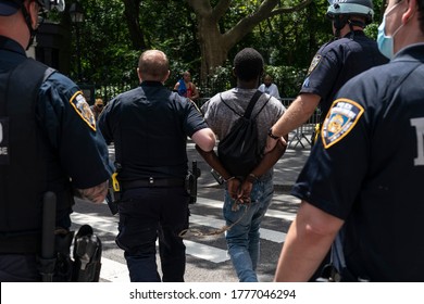 New York, NY - July 15, 2020: BLM protester arrested by police at the Jericho The Power of Prayer rally and march against gun violence at City Hall