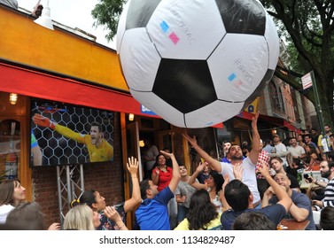 NEW YORK, NY- JULY 2018:  A giant soccer balloon ball floats over a crowd in Brooklyn as they watch France win the World Cup soccer title.  - Shutterstock ID 1134829487
