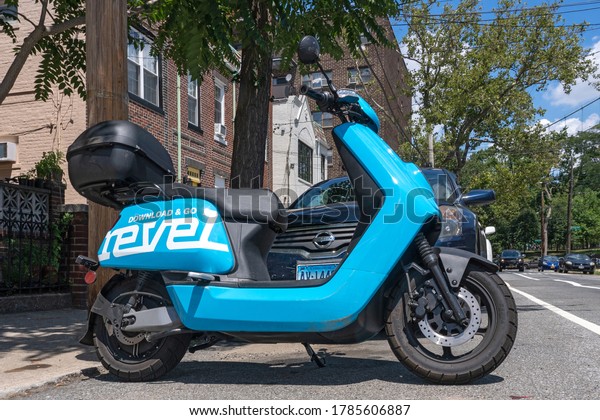 NEW
YORK, NY - JULY 28, 2020: A Revel moped sits unused. The app-based
scooter rental company halted operations in New York City after two
customers were killed in separate crashes in
July.