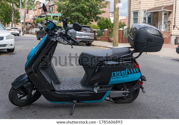 NEW\
YORK, NY - JULY 28, 2020: A Revel moped sits unused. The app-based\
scooter rental company halted operations in New York City after two\
customers were killed in separate crashes in\
July.