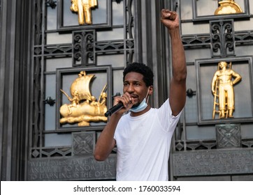 New York, NY - June 19, 2020: Jon Batiste raises ckenched hand at the 'We Are: a Voter Registration' recital during Juneteenth celebration at Brooklyn Public Library at the Grand Army Plaza