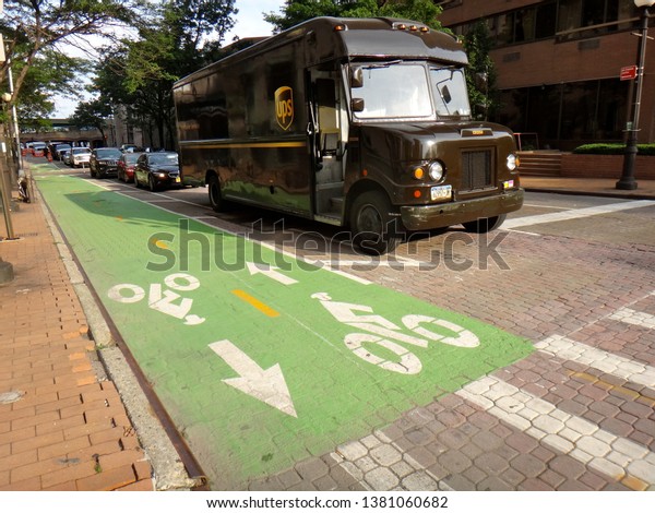 New York, NY - June 19\
2015: A two-way protected bike lane on East 37th Street in Murray\
Hill in Manhattan